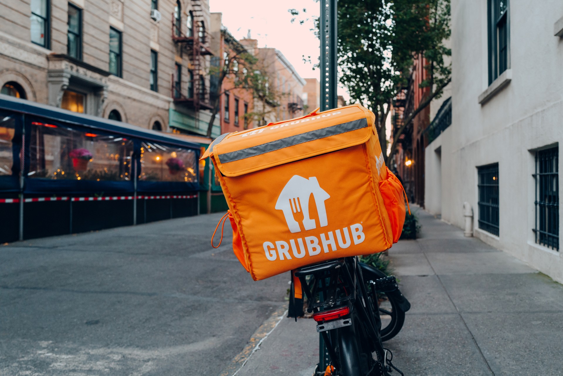 Grubhub bag on a delivery bike on a street in USA.